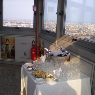 a kitchen with a fireplace and a large window
