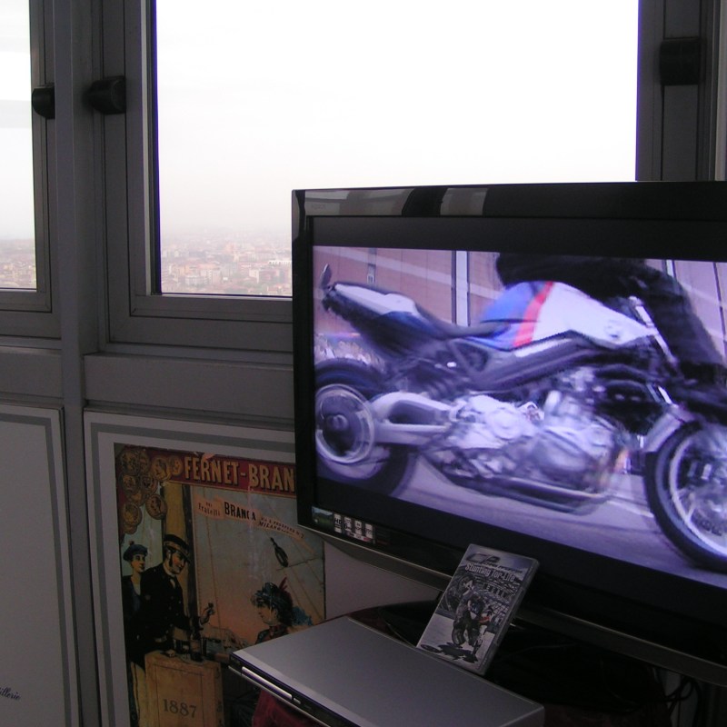 a desktop computer monitor sitting on top of a window