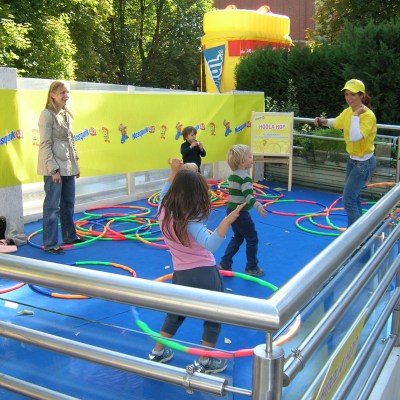 a group of people standing next to a fence