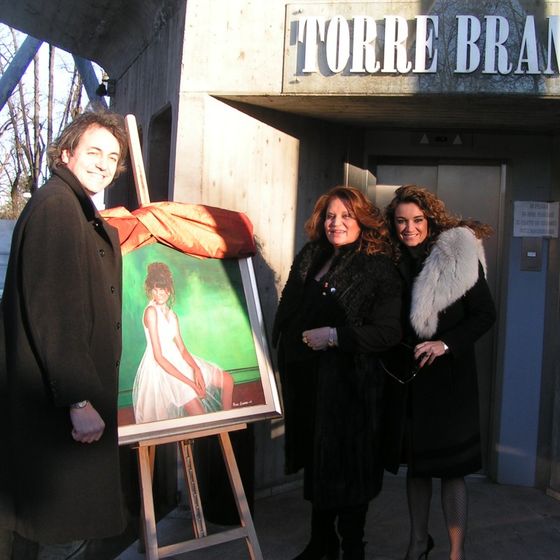 a man and a woman standing in front of a building